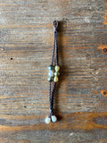 RÉSERVÉ Magnifique bracelet de perles de Tahiti et Australie montées sur cuir tressé.