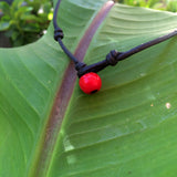 Collier perle Tahiti sur cuir collier unisexe véritable perle de Tahiti certifiée perle padre rouge au fermoir.