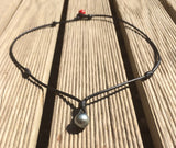 Collier perle Tahiti sur cuir collier unisexe véritable perle de Tahiti certifiée perle padre rouge au fermoir.