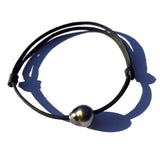 Perle noire de Tahiti, bracelet adaptable unisexe, cuir australien. Véritable perle noire de très bonne qualité.