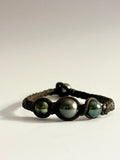 Bracelet quatre perles de Tahiti sur cuir tressé