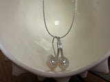 Tahitian pearl earrings on leather, solid silver