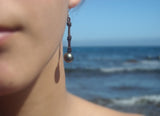 Perles de Tahiti boucles d'oreilles sur cuir, argent massif