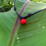  Collier perle Tahiti sur cuir collier unisexe véritable perle de Tahiti certifiée perle padre rouge au fermoir.